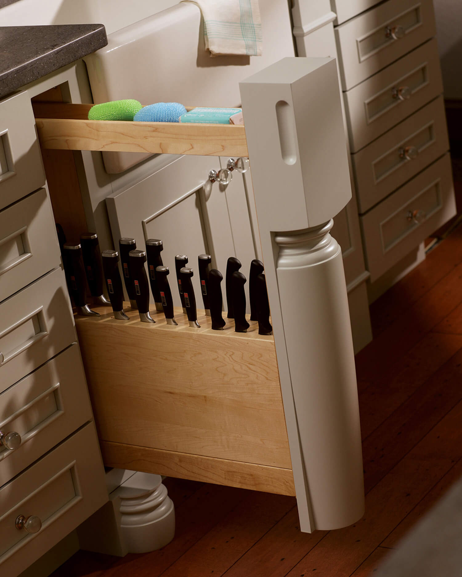 Individual slots in our Pull-Out Slotted Knife Block protect blades and keep handles accessible. Tucking it behind a decorative turned post of your choice disguises the storage cabinet.
