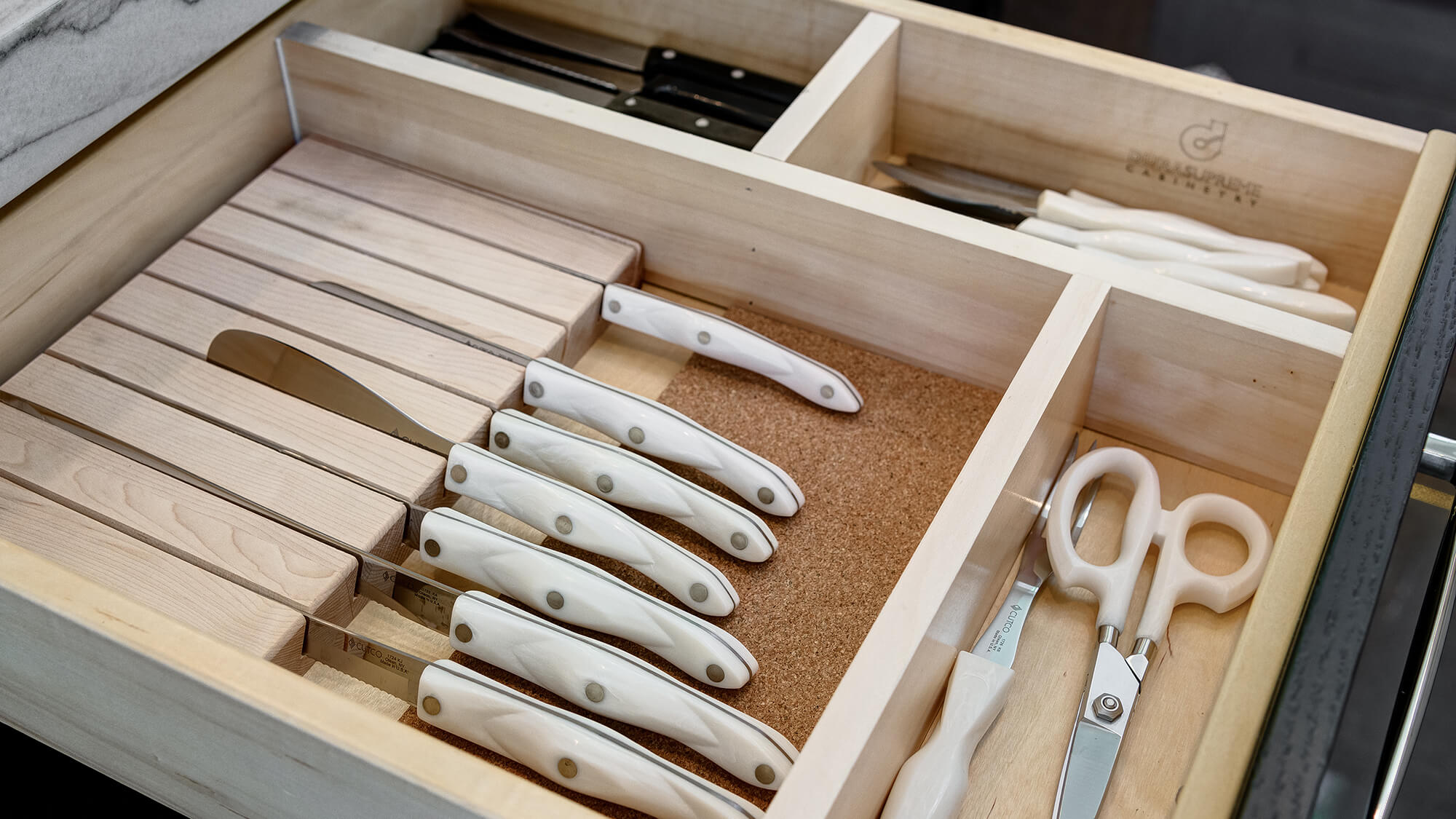 With Dura Supreme Cabinetry, drawers can be compartmentalized to create exceptional organization with a Drawer Knife Holder and Drawer Partitions.