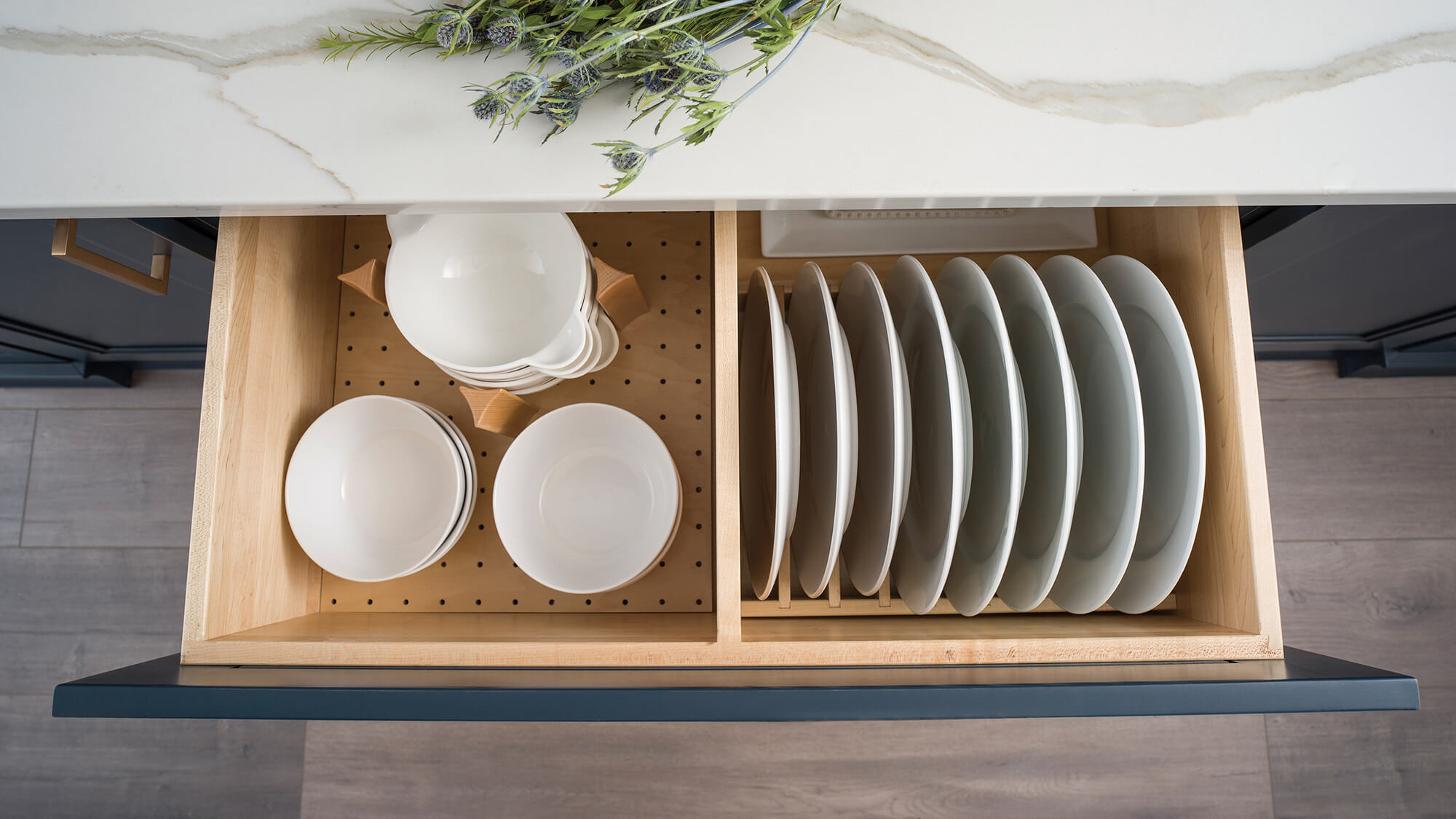 Dura Supreme’s Plate Rack combined with the Dish Storage Drawer creates a convenient spot to neatly store and organize an entire set of dishware. Storing your dishware collection below the countertop creates a more accessible option for all family members.