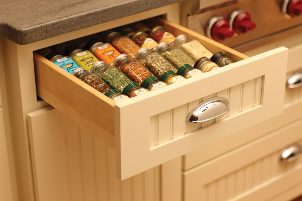 Keep your spices at your fingertips in this convenient, wood Drawer Spice Rack next to an oven or baking center. Kitchen Storage solutions for spice racks from Dura Supreme Cabinetry.