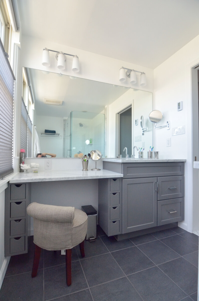 This bathroom space features a prime example of incorporating varied height vanities for the primary user. The lower portion is ideal for putting on make-up while the taller vanity is great for washing your hands and face. Bathroom was designed by Devin Mearing of dRemodeling, Philadelphia PA.