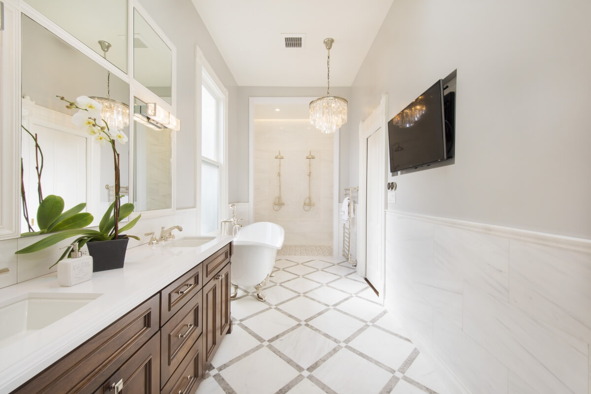 This exquisite bathroom designed by Gilmans Kitchens and Baths in California is a perfect example of having enough clear space in front of all the bathroom fixtures.
