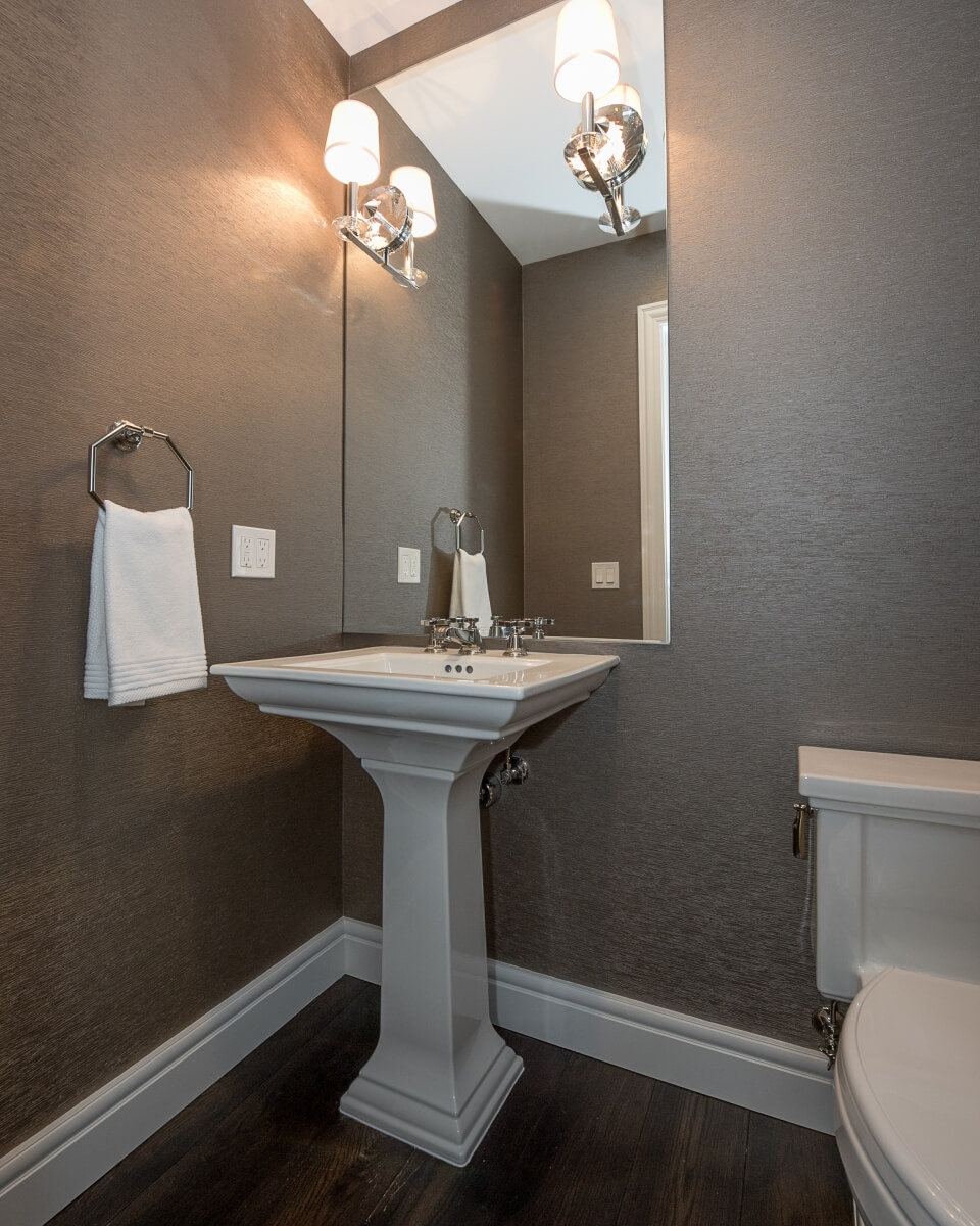 Example of the NKBA Bathroom Guideline Single Lavatory Placement for a free-standing pedestal sink. Designed by Pinnacle Design, Saginaw, Michigan, and photographed by Dan Denardo.