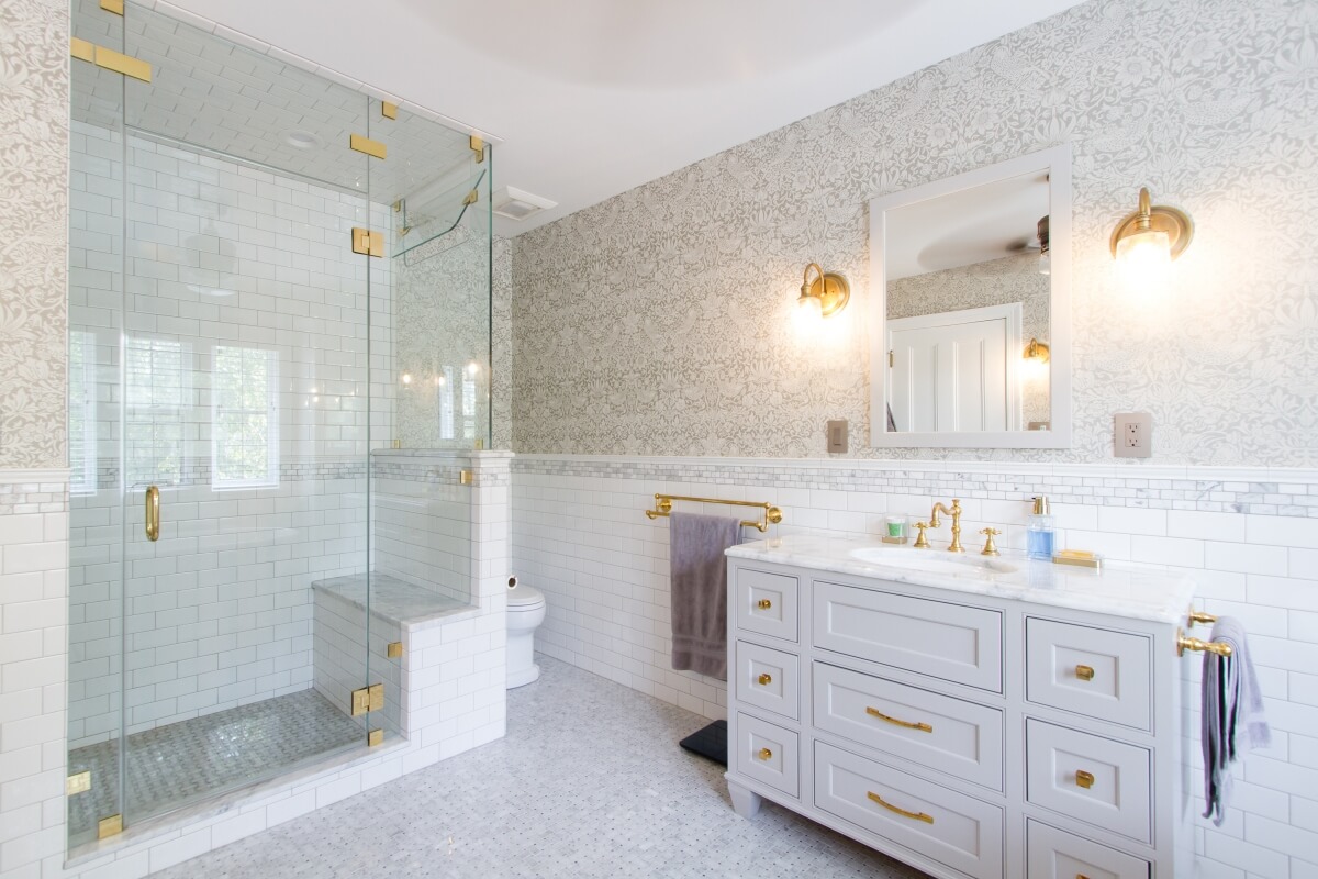 The shower in this lovely bathroom is a perfect example of a decent shower size that provides an incorporated bench and plenty of elbow room to bath and move around properly. Bathroom designed by Theresa Major of North Shore Kitchen and Bath, Milwaukee, WI.