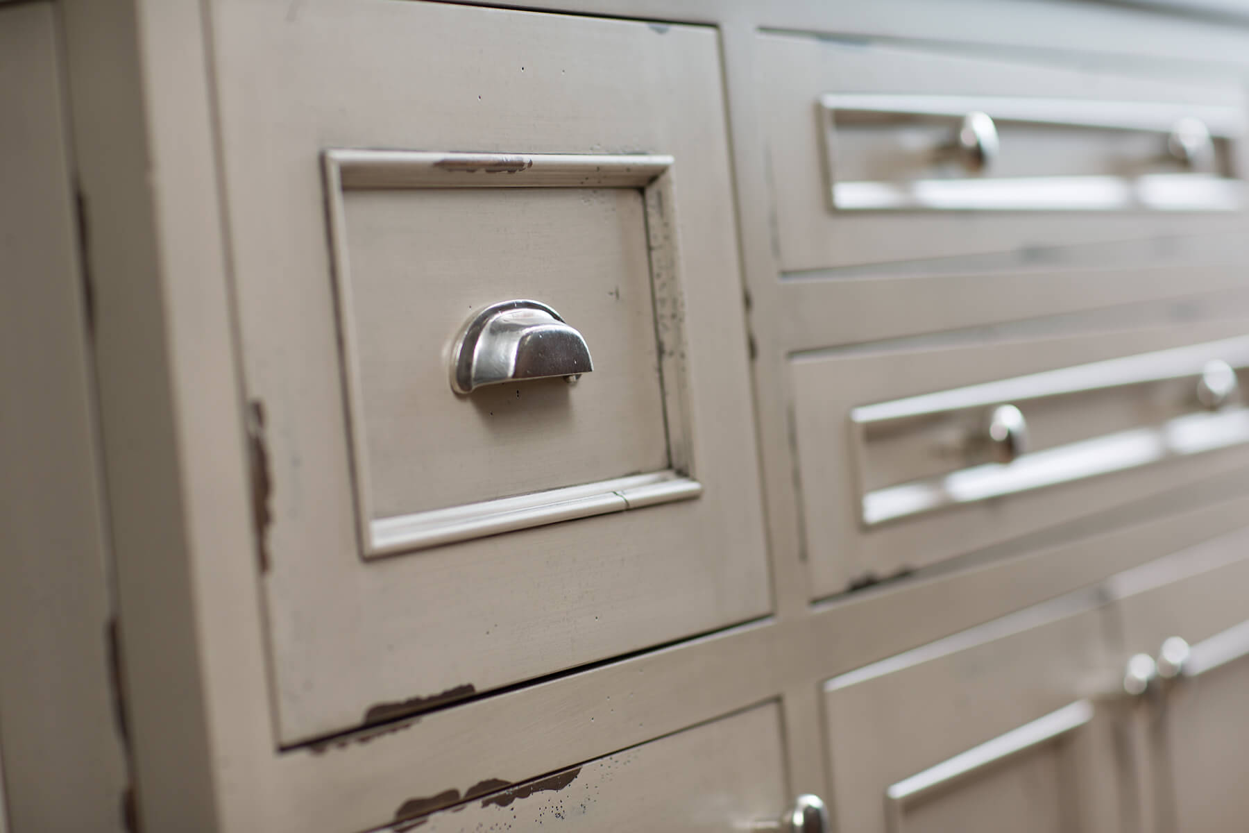 A kitchen island with a beautiful distressed paint finish with Dura Supreme's Heritage Paint finish.