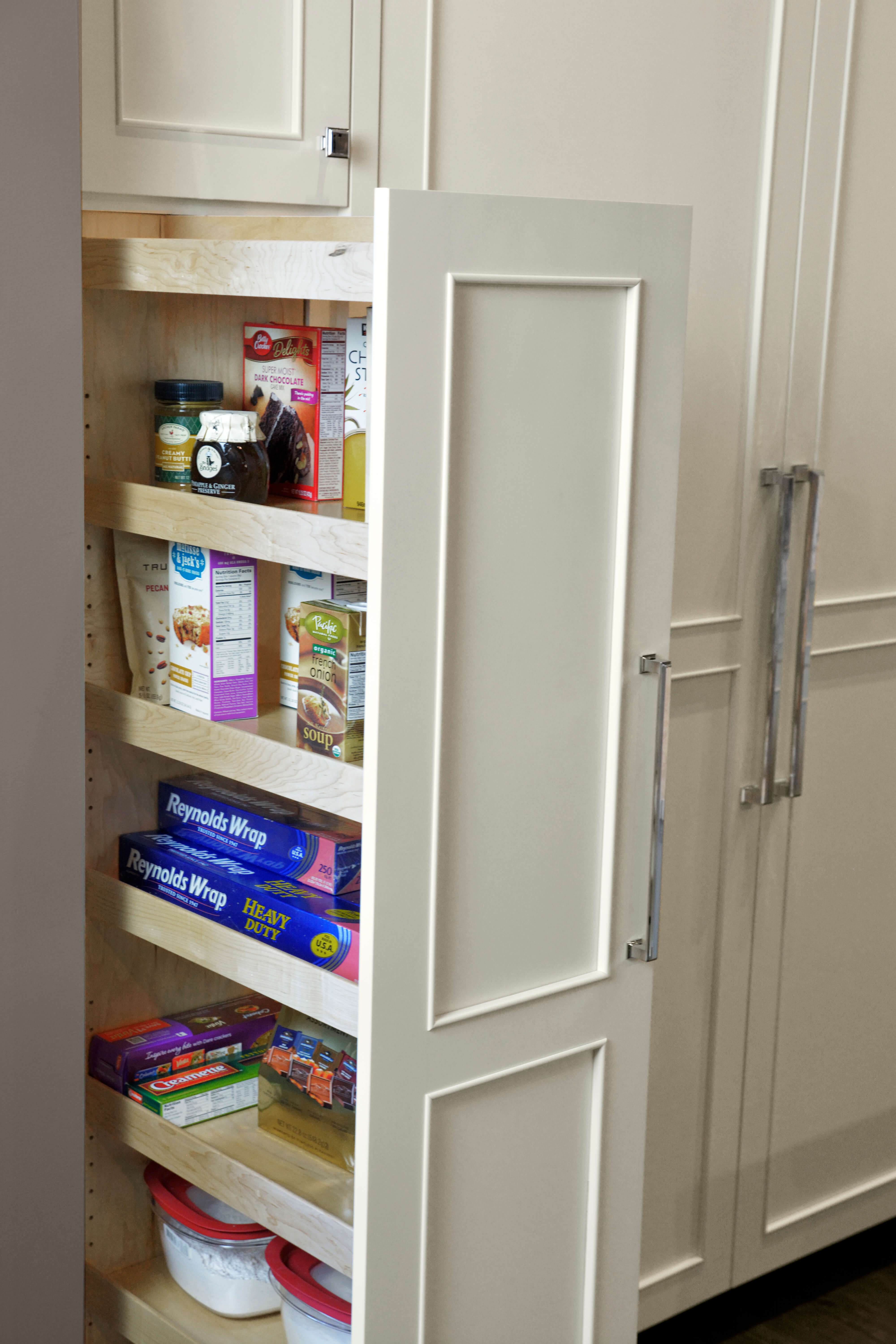 Dura Supreme's Tall Pull-Out Pantry provides an amazing amount of storage on full extension glides. Available with wood (shown) or wired shelves. Discover pantry storage solutions for your kitchen remodel project.