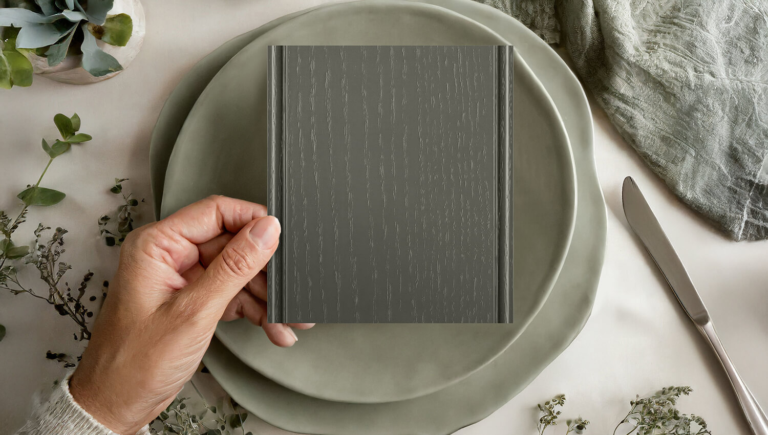 A sample of Dura Supreme's painted oak in a neutral green paint color.
