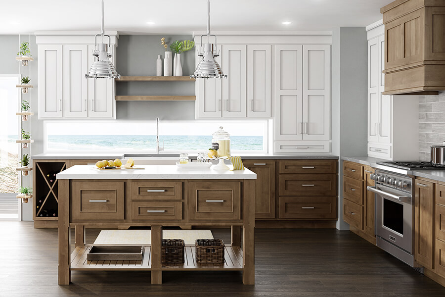 A lovley ocean home with standard overlay cabinets from Dura Supreme Cabinetry. A mix of white painted cabinets for the uppers and stained cherry cabinets for the lowers and wood hood.