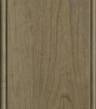 This finish color for Cherry kitchen & bath cabinets is shown in the Cashew stained finish by Dura Supreme Cabinetry. A light to medium stain color with a brown-gray undertone.