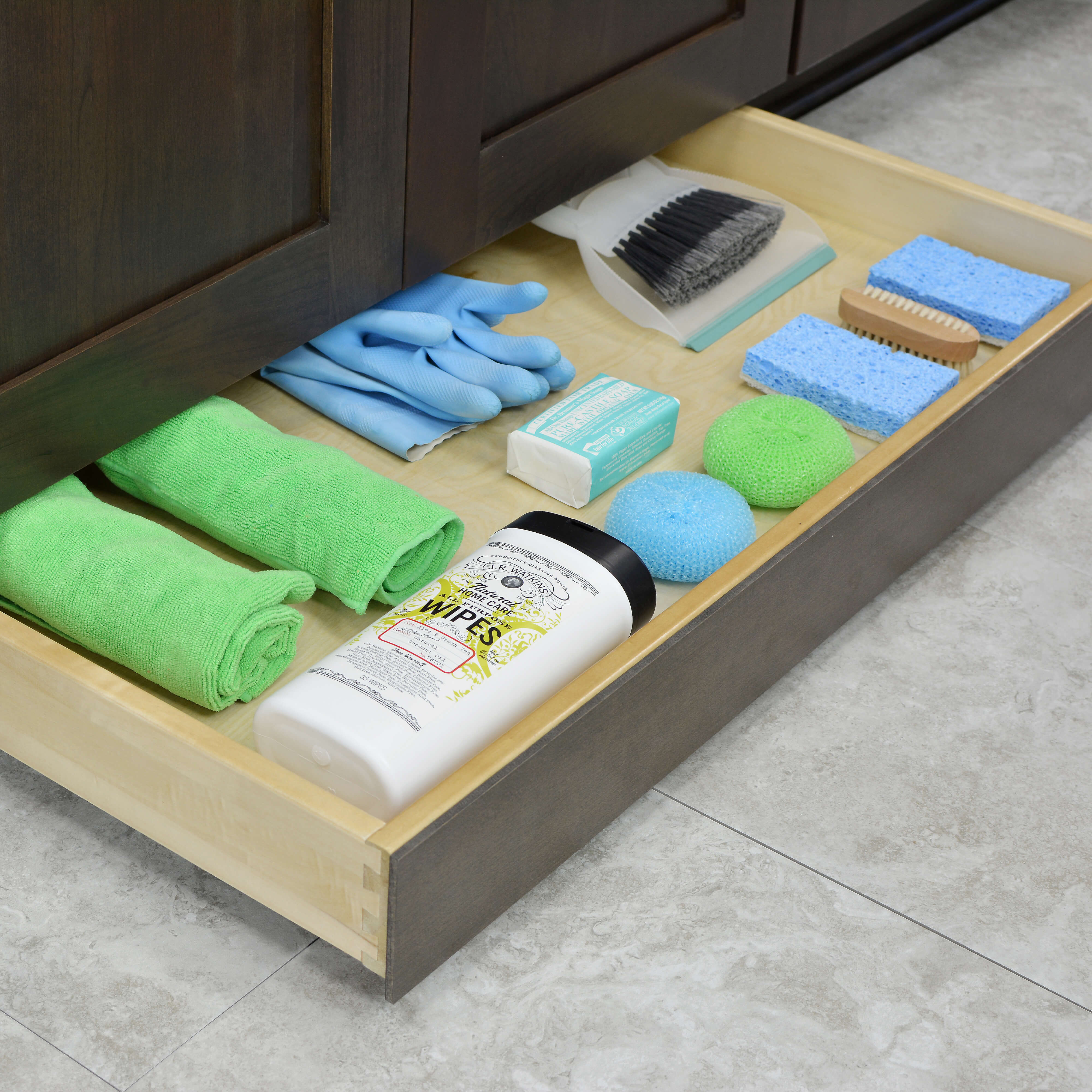A toe kick drawer near an area that requires frequent cleaning, link at a kitchen island or near a kitchen sink can provide a space to store cleaning supplies close at hand.