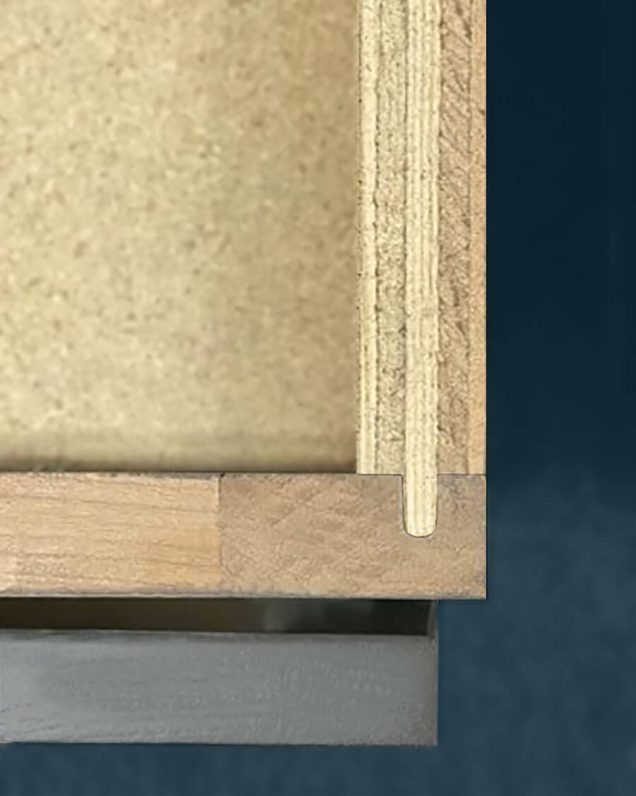 A close up of the cabinet box construction joinery showing plywood and solid wood conjoined with a Dado joint.