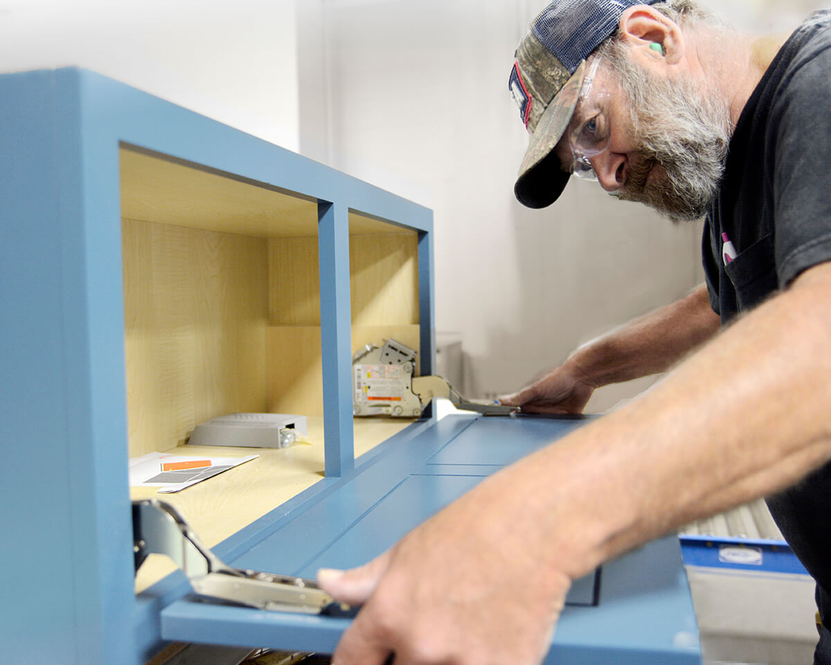 Dura Supreme cabinet maker assembling a cabinet.