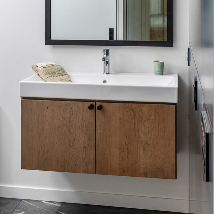 A small floating vanity with cherry wood cabinets from Dura Supreme.