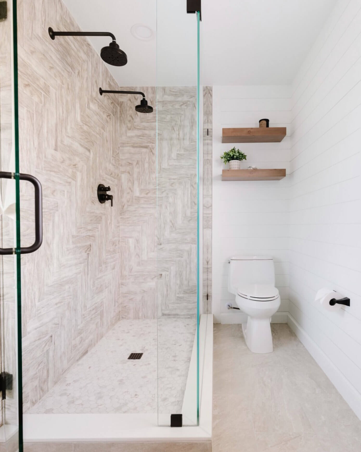 Two floating shelves above the toilet match the vanity.