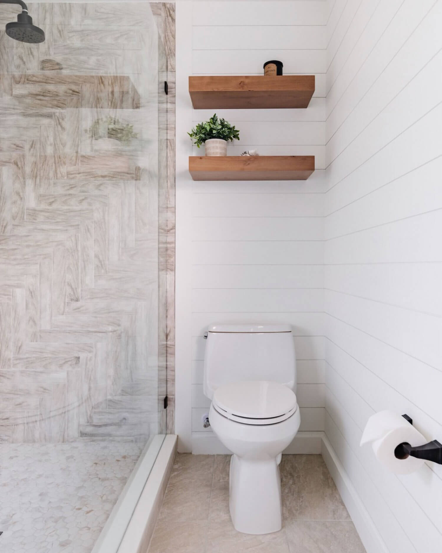 Two floating shelves above the toilet match the vanity.