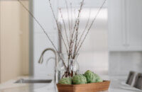 A closeup of the waterfall counter top on the kitchen island with Cambria quartz.