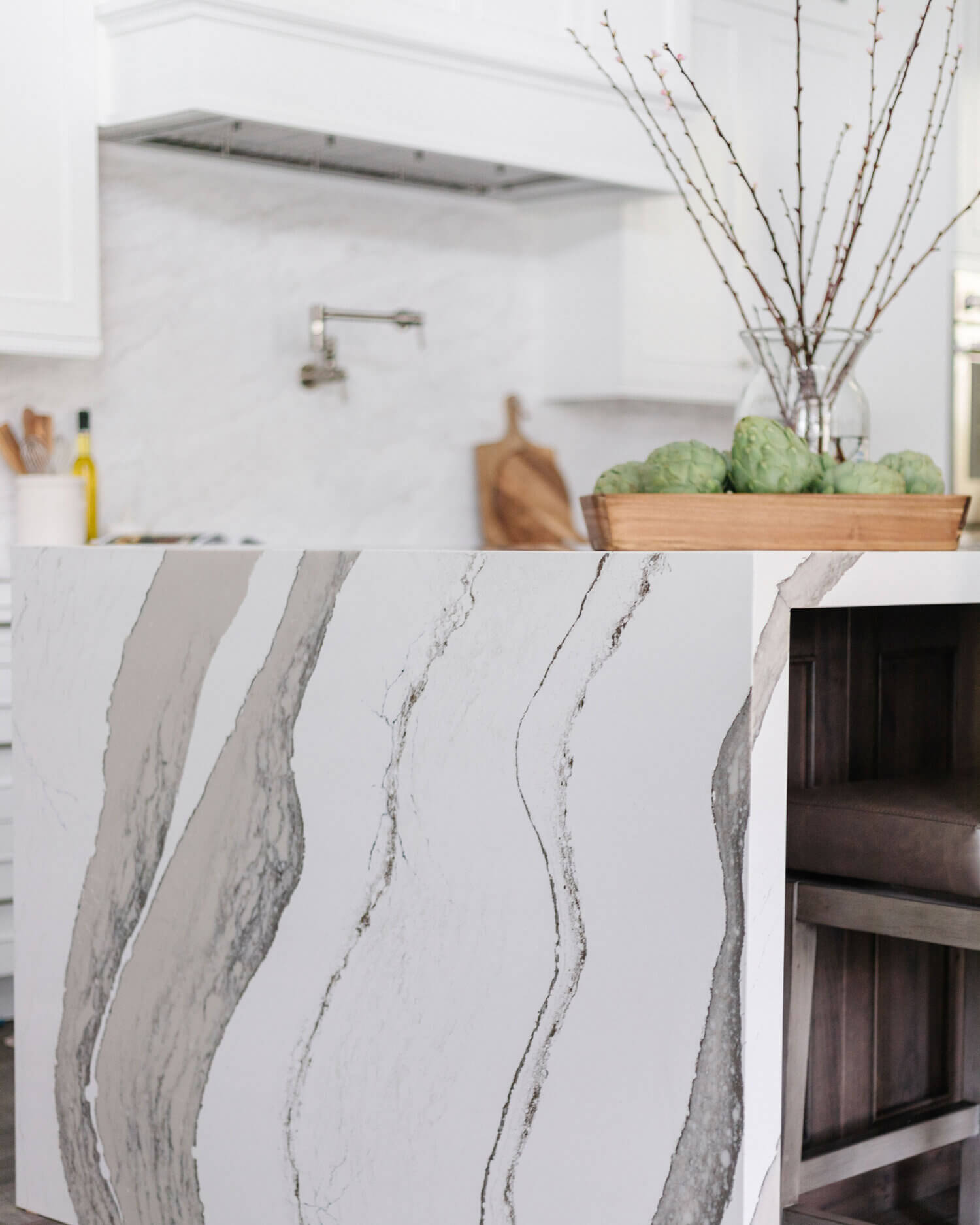 A closeup of the waterfall counter top on the kitchen island with Cambria quartz.
