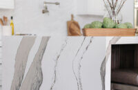A closeup of the waterfall counter top on the kitchen island with Cambria quartz.