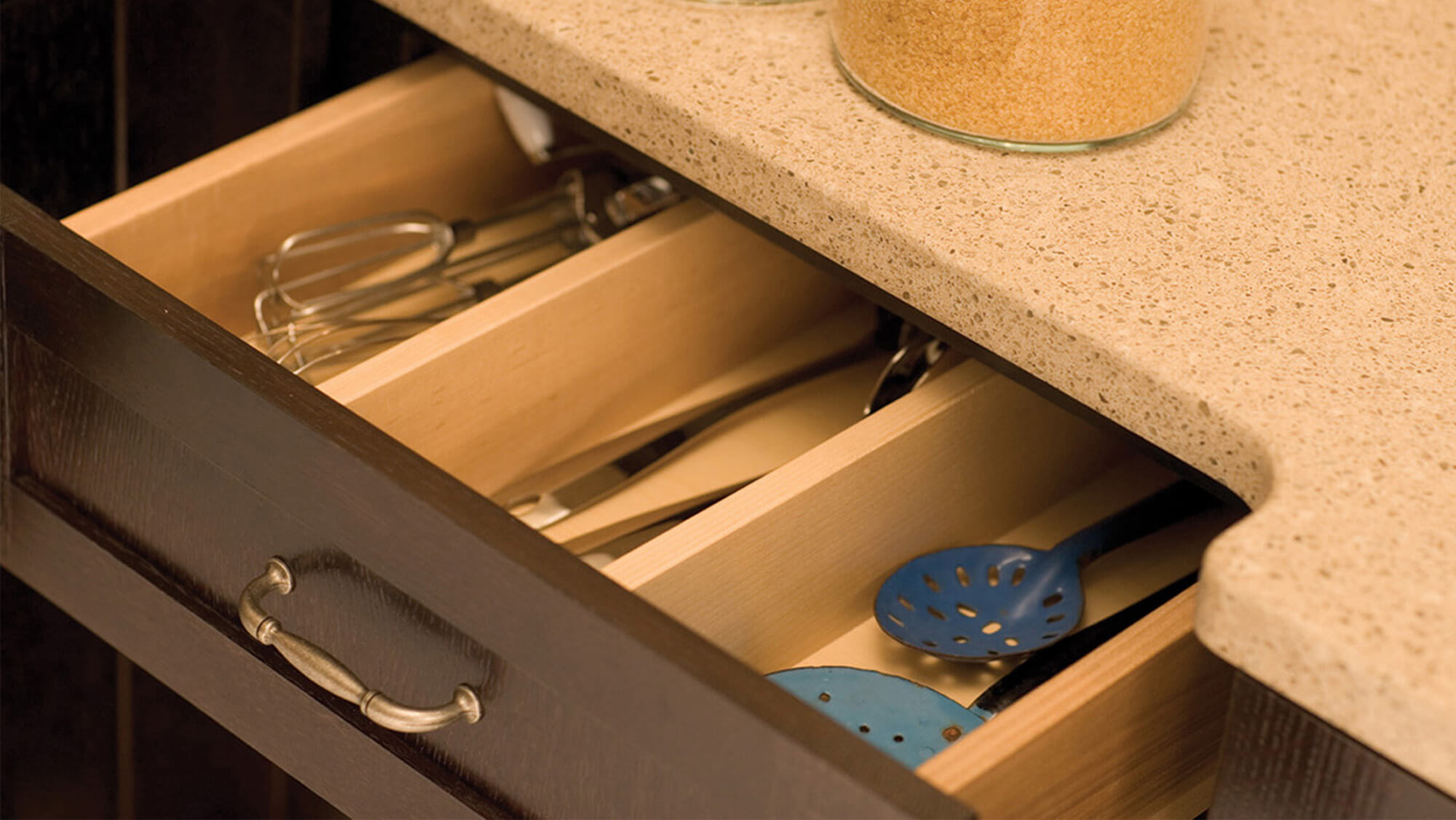 Drawer partitions can be specified to divide a drawer based on your personal preferences. Kitchen Drawer Storage from Dura Supreme Cabinetry.